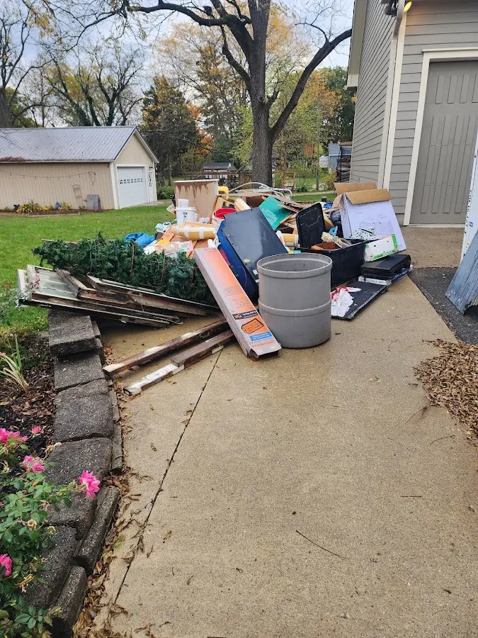 Dumpster being loaded with debris for Estate Cleanout Dumpster Rental in North Haledon